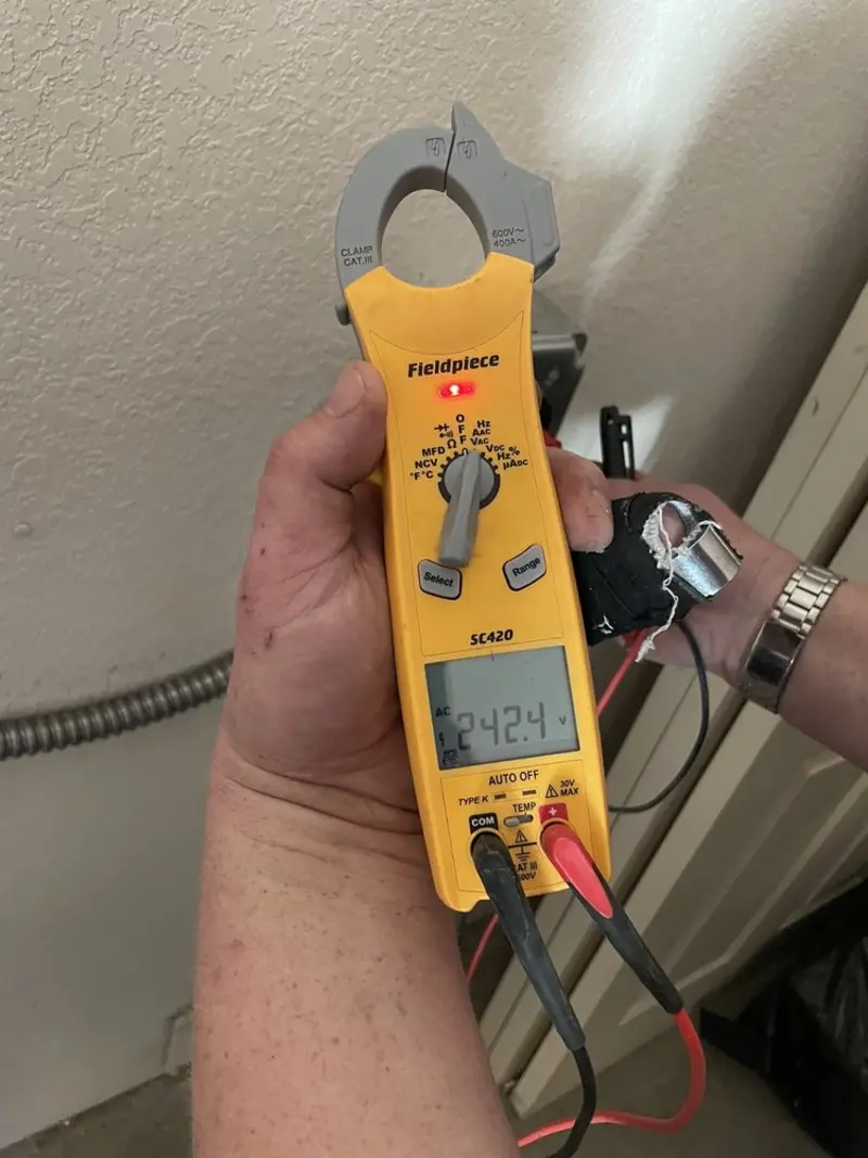 Voltage testing with clamp meter during Recessed Lighting Installation in Alexandria